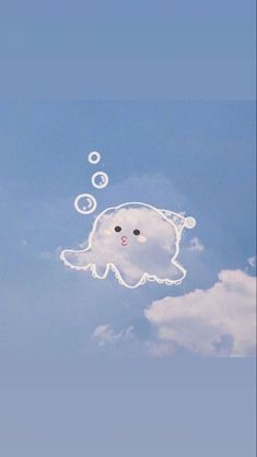 an animal floating in the sky with bubbles