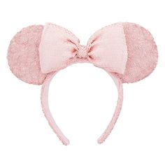 a pink minnie mouse ears headband on a white background