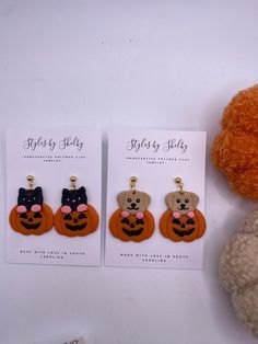 Handmade polymer clay dog/cat in pumpkins dangle earrings. All posts are hypoallergenic. Halloween Cat Clay Earrings, Cheap Halloween Cat Design Earrings, Black Cat Polymer Clay Earrings, Novelty Orange Earrings For Halloween, Novelty Halloween Earrings, Halloween Animals, Halloween Earrings, Handmade Polymer Clay, Polymer Clay Jewelry