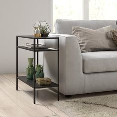 Optimize your space and add some charm to your room with the 24-inch steel end table with two shelves. This table is made from steel in a neutral color throughout the base and top. Includes 2 shelves for additional storage or display space. A great accent on either side of the sofa or bed, this adorable end or side table is just what you need. You can match it with other pieces to get the ideal look for your place. 24-inch H x 24-inch W x 10-inch D. AllModern Color: Blackened Bronze AllModern Le Rectangular Side Table, Bronze Side Table, Glass Top End Tables, Glass End Tables, Sofa End Tables, Metal Side Table, Side Table With Storage, End Tables With Storage, Modern Furniture Living Room