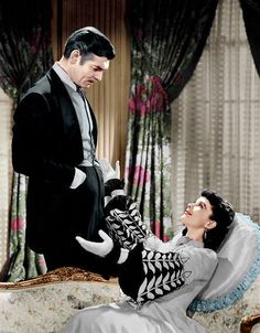 a man in a tuxedo sitting on top of a bed next to a woman