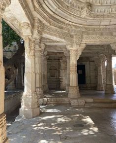 the inside of an old building with columns and arches on either side, in india