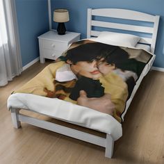 a bed with an image of two people on it