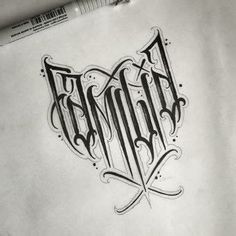 a drawing of the word tattoo on paper