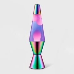 a multicolored vase sitting on top of a white table