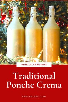 three bottles filled with liquid sitting in front of a christmas tree and the words traditional ponche crema