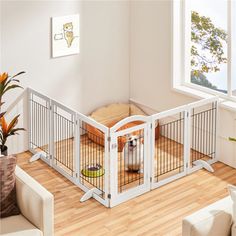 a living room filled with furniture and a dog in a cage