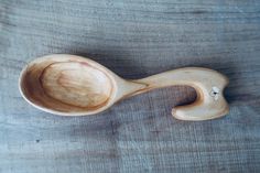 a wooden spoon sitting on top of a table