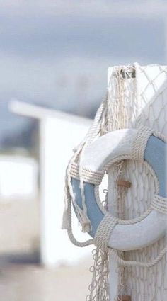 a close up of a boat's rope and buoy