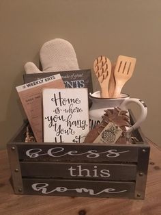 a wooden crate filled with kitchen items and utensils on top of a table