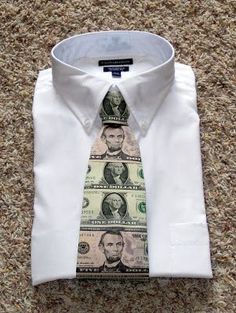 a dollar bill tie on top of a white shirt and dress shirt with money printed on it