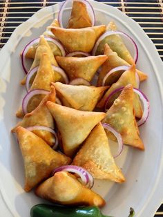 some food is on a white plate with green peppers