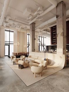 a large room with lots of white furniture and exposed pipes on the ceiling, along with floor to ceiling windows