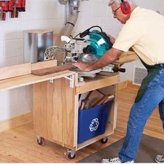 a man is using a circular saw to cut wood with a table sawtoother