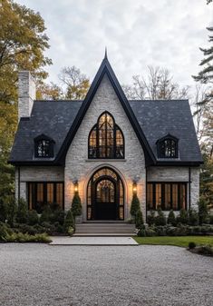 this is an image of a house in the country style with stone and shingles