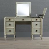 an antique white dressing table with mirror and stool