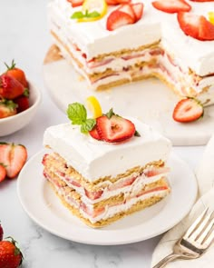 there is a piece of cake with strawberries on the top and one slice missing