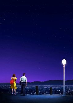 a man and woman standing next to each other under a purple sky with stars above them