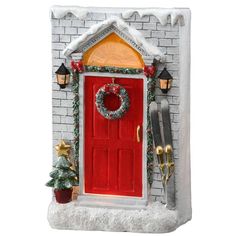 a red door is decorated with christmas decorations