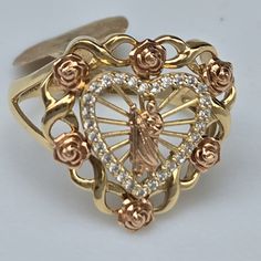 Solid Real genuine 14k Yellow Gold Beautiful 2 tone 14k yellow and rose gold heart and flower saint jude ring . Looks much better in person. Piece of art,  just lovely. excellent quality , brilliance and design It is hallmarked 14k inside the ring for authenticity See pics for detail and size, it appears bigger in pictures. made in italy Approximate measurments weight: 3.3 grams Width: 0.70x0.75 inch Size: 7 /sizable message me your ring size before or same time as checkout, free sizing up/ down to two sizes Order with confidence, we have earned top rated and 100% positive feedback for our excellent jewelry and services. Your satisfaction is my priority. Returns are accepted within 30 Days in original condition for any reason.in original condition, Free and fast shipping Free gift box Free Gold Rings Virgin Mary, Gold Rings Mexican, Quince Rings, Sweet 16 Rings, Quince Themes, Quinceanera Jewelry, Latina Jewelry, Saint Jude, Rose Gold Heart