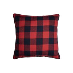 a red and black plaid pillow on a white background