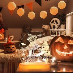 halloween decorations and pumpkins are on the table