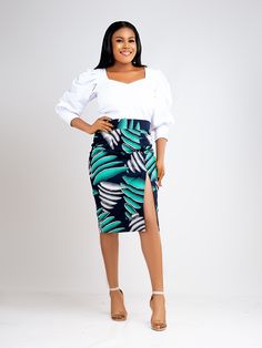 Stand out in this eye-catching soraya skirt. Step into this slim fit pencil skirt designed with a front slit and back zipper. Featuring a comfortable waistband, this printed skirt is carefully crafted from 100% Ankara wax cotton. Its as flattering as it is comfy. Description 100% Cotton African Print Wax Front slit Back invisible zipper Fully lined for added comfort 2.5 inches waist band Medium Length of top is 26 inches Made in Cameroon Fabric from Benin Care instructions Hand wash cold Hang to Straight Skirts Designs, Kitenge Skirts Designs, Ankara Skirts Designs, Chitenge Skirts, Chitenge Designs, Kitenge Outfits, Straight Skirt Outfits, African Pencil Skirt, Ankara Pencil Skirt