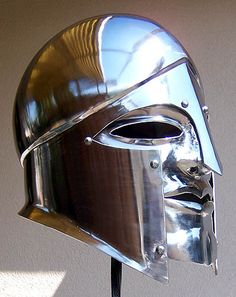 a metal helmet is shown on a stand