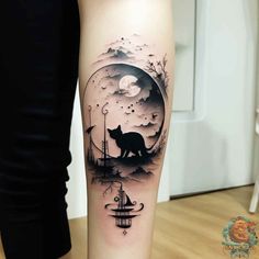 a woman's leg with a black and white cat on it, in front of the moon