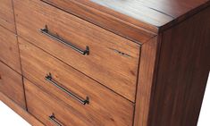 a wooden dresser with metal handles and drawers