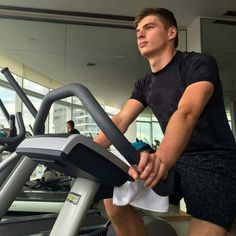 a man on a treadmill in a gym