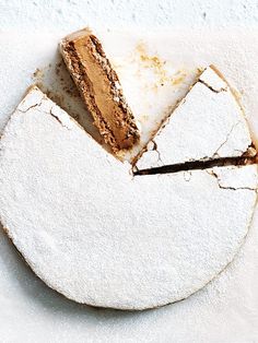 a white plate topped with a slice of cake