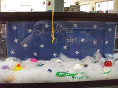 a display case filled with lots of different types of beads and snowflakes