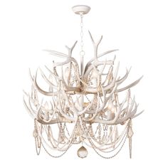 a white chandelier with deer antlers hanging from the ceiling