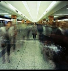 a blurry photo of people walking through an airport