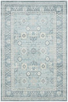 a light blue rug with an ornate design on the middle and bottom part of it