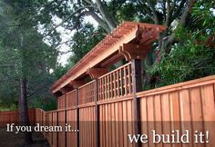 a wooden fence with the words if you dream it we build it