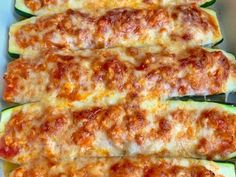 zucchini stuffed with cheese and sauce in a pan