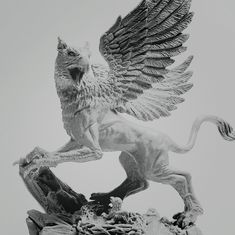 a statue of a lion with wings on it's back