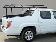 a white pick up truck parked in a parking lot