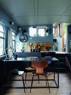 Presenting our third great houseboat discovery of late: architect Valérie Mazerat's industrial-chic Paris barge that she designed for herself and her young daughter. We found it in a book photographed by Richard Powers that chronicles how the city's creative class lives. Boat Life