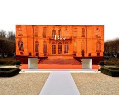 an orange building with the word dior painted on it