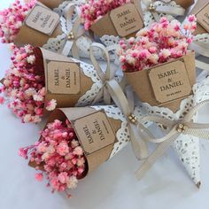 small flowers are wrapped in brown paper and tied with ribbon