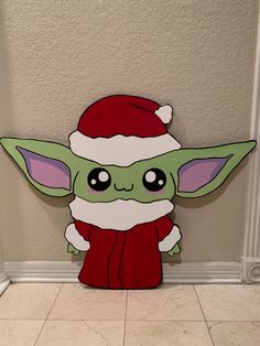 a star wars yoda cut out on the floor