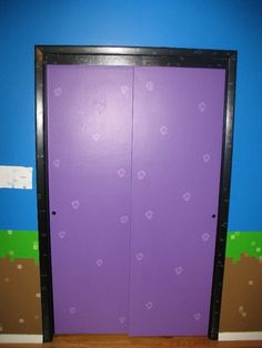 a purple door in the corner of a room