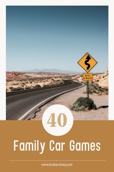 a road sign with the words family car games written on it in front of a desert landscape