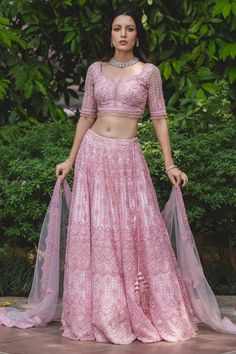 Powder pink lehenga with attached cancan, highlighted with tonal resham embroidery and embellishments. Comes with sweetheart neckline padded blouse and dupatta.
Component: 3
Embroidered
Neckline: Sweetheart
Sleeve Length: Elbow
Fabric: Tulle
Color: Pink
Sequin, beads, cutdana and crystal embroidery
Embroidered blouse with beaded tassels at the sleeves and hem
Tie-up at the back with latkans
Scallop edged hem lehenga
Embroidered dupatta - Aza Fashions Tulle Embroidery, Crystal Embroidery, Pink Lehenga, Embroidered Lehenga, Embroidered Neckline, Pink Tulle, Pink Sequin, Designer Gowns, Powder Pink