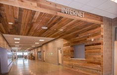 the interior of an office building with wood paneling