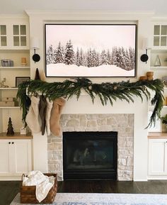 a fireplace decorated for christmas with stockings and stockings hanging from the mantel above it