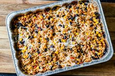 an uncooked casserole dish is sitting on a cutting board and ready to be eaten